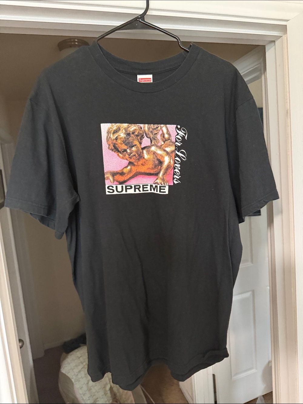 Supreme Black Crewneck T-Shirt with Cherub Graphic and Pink Accent